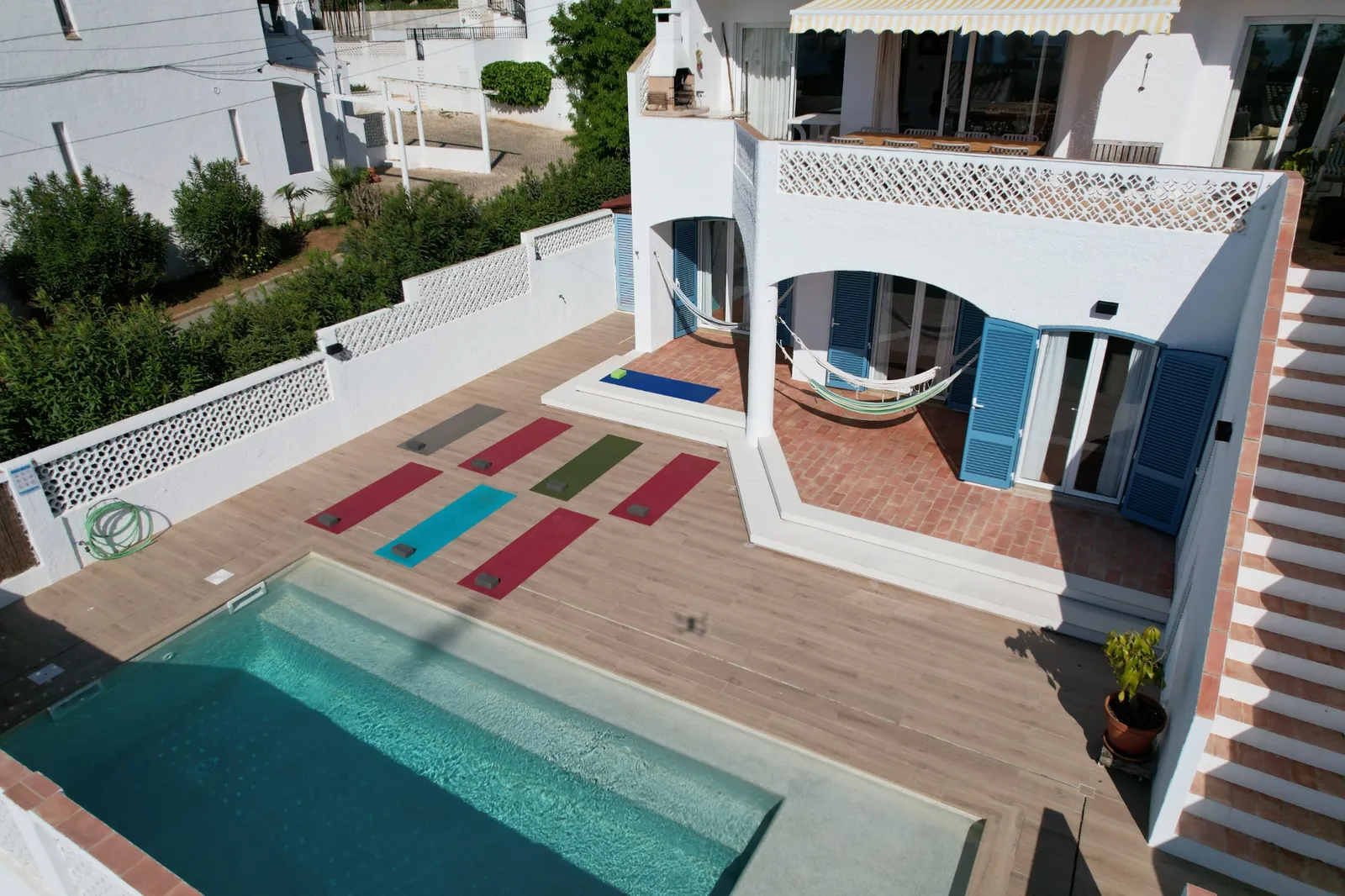 Aerial-view-yoga Pool and hammock area at Jho’La Surf Camp in Praia da Luz, Algarve